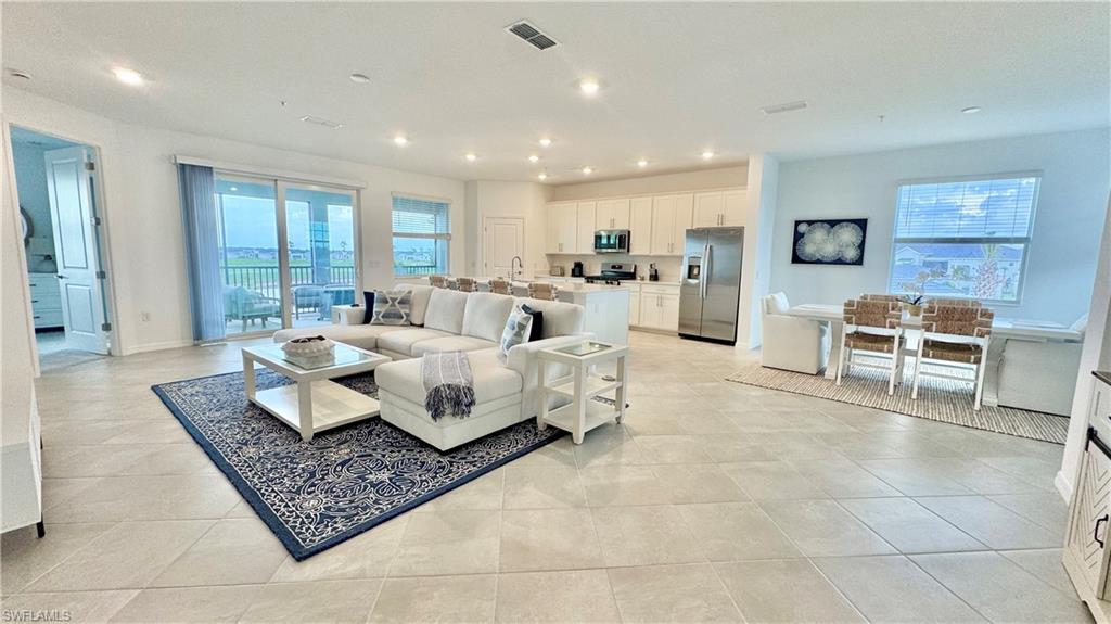 Open living room with sliding doors to the lanai