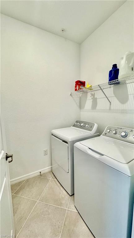 Dedicated laundry room with full-size washer and dryer